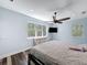 Bedroom featuring hardwood style floors, natural light, a decorative ceiling fan, and neutral paint at 34335 Berryhill Dr, Webster, FL 33597