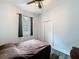 Bedroom featuring wood-look floors, ceiling fan, closet and a window at 34335 Berryhill Dr, Webster, FL 33597