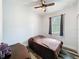 Bedroom featuring wood-look floors, ceiling fan, and window, and a teddy bear at 34335 Berryhill Dr, Webster, FL 33597