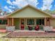 Inviting front porch with comfortable seating area and stylish design elements that exude curb appeal at 34335 Berryhill Dr, Webster, FL 33597