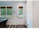 Bright room featuring white trim, a door to the exterior, and a view to the outside at 34335 Berryhill Dr, Webster, FL 33597