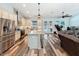 Open kitchen with stainless steel appliances, granite countertops, and island at 34335 Berryhill Dr, Webster, FL 33597