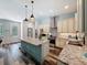 Kitchen featuring granite countertops, stainless steel appliances, center island with a sink, and wood-look floors at 34335 Berryhill Dr, Webster, FL 33597