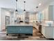 Bright kitchen with granite countertops, stainless steel appliances, large island, and a door to the pantry at 34335 Berryhill Dr, Webster, FL 33597