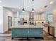 Bright kitchen boasts granite countertops, stainless steel appliances, spacious island, and a pantry for storage at 34335 Berryhill Dr, Webster, FL 33597