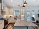 Spacious kitchen with large granite island and stainless steel appliances at 34335 Berryhill Dr, Webster, FL 33597