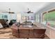 Bright living room with a comfortable sofa, modern entertainment system, and large windows at 34335 Berryhill Dr, Webster, FL 33597