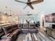 Living room view with hardwood style floors, open concept, view into the kitchen, and access to the pool area at 34335 Berryhill Dr, Webster, FL 33597