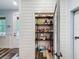 Walk-in pantry with shelving for optimal storage and organization in a modern home at 34335 Berryhill Dr, Webster, FL 33597