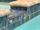 Close-up of the pool's edge, showcasing its tile and water feature, exuding luxury at 34335 Berryhill Dr, Webster, FL 33597