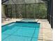 Inviting screened-in pool and spa with clear blue water, perfect for relaxing outdoors at 34335 Berryhill Dr, Webster, FL 33597