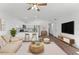 Inviting living room open to the kitchen, with modern furnishings and ample natural light at 3554 Arrowhead Ave, Spring Hill, FL 34606