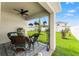 Charming backyard featuring a covered patio and meticulously kept green spaces at 3900 Autumn Amber Dr, Spring Hill, FL 34609