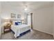 Inviting bedroom with a comfortable bed, soft lighting, and window at 3900 Autumn Amber Dr, Spring Hill, FL 34609