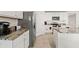 Bright kitchen showcasing granite countertops, stainless steel appliances and ample counter space perfect for cooking prep at 3900 Autumn Amber Dr, Spring Hill, FL 34609