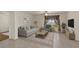 Cozy living room with neutral tones, a stylish rug, and a comfortable sofa that offers a relaxing space at 3900 Autumn Amber Dr, Spring Hill, FL 34609
