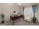 Bright office featuring a large desk, a cozy armchair, and natural light at 3900 Autumn Amber Dr, Spring Hill, FL 34609