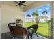 Relaxing patio with comfortable seating, overlooking a well-maintained backyard at 3900 Autumn Amber Dr, Spring Hill, FL 34609