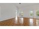 Spacious living room featuring tile floors and a door leading to the outdoor area at 4125 Mc Clung Dr, New Port Richey, FL 34653