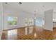 Bright and airy living room featuring tile floors, windows and an outdoor view at 4125 Mc Clung Dr, New Port Richey, FL 34653