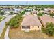 Overhead shot of the property with a screened in lanai and manicured backyard at 4266 High Ridge Ave, Spring Hill, FL 34609
