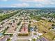 An aerial view shows a house located near community park and playground with lots of green space at 4266 High Ridge Ave, Spring Hill, FL 34609