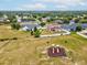 Aerial view of residential neighborhood with lush green space and a community playground at 4266 High Ridge Ave, Spring Hill, FL 34609