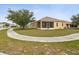 Backyard featuring a screened lanai and mature landscaping at 4266 High Ridge Ave, Spring Hill, FL 34609