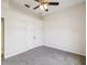 Spacious bedroom featuring carpet floors, a ceiling fan, and a large closet at 4266 High Ridge Ave, Spring Hill, FL 34609