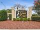 Sand Ridge community sign with manicured landscaping and clear blue sky at 4266 High Ridge Ave, Spring Hill, FL 34609