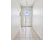 Inviting foyer features tile floors, a transom window and an arched opening at 4266 High Ridge Ave, Spring Hill, FL 34609