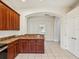 Kitchen featuring dark wood cabinets and a tiled floor at 4266 High Ridge Ave, Spring Hill, FL 34609