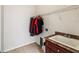 Convenient laundry room featuring a utility sink and ample storage shelving at 4266 High Ridge Ave, Spring Hill, FL 34609
