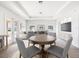 Bright living room features neutral tones, recessed lighting, and an adjacent dining area at 4266 High Ridge Ave, Spring Hill, FL 34609