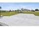 Recreational area with a community playground, concrete slab, surrounded by green space in a residential neighborhood at 4266 High Ridge Ave, Spring Hill, FL 34609