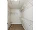 Walk-in closet featuring ample shelving for storage and organization at 4266 High Ridge Ave, Spring Hill, FL 34609