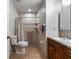 Neutral bathroom with tiled walk-in shower, grab bars, and updated vanity at 4289 Castle Ave, Spring Hill, FL 34609