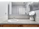 Bathroom vanity featuring neutral countertop, a large mirror and stylish faucet at 4289 Castle Ave, Spring Hill, FL 34609