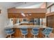 Open kitchen featuring bar seating, stainless steel appliances, and wood cabinetry at 4289 Castle Ave, Spring Hill, FL 34609