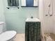 Cozy bathroom featuring toilet, sink with decorative covering, and a shower at 4388 Craftsbury Dr, New Port Richey, FL 34652