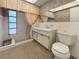 Bathroom featuring a vanity, framed mirror, toilet, and a shower with a curtain at 4388 Craftsbury Dr, New Port Richey, FL 34652