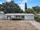 Charming single-story home with a well-maintained exterior, classic shutters, and a one car attached garage at 4388 Craftsbury Dr, New Port Richey, FL 34652