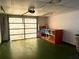 Open garage with storage shelves and workbench potential at 4388 Craftsbury Dr, New Port Richey, FL 34652
