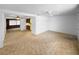 Bright living room featuring a ceiling fan and adjoining kitchen area at 4388 Craftsbury Dr, New Port Richey, FL 34652