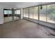 Enclosed room with windows for ample natural light and an exit to the yard at 4388 Craftsbury Dr, New Port Richey, FL 34652
