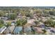 Expansive aerial view of a residential neighborhood with lush tree coverage creating a calm setting at 4503 Courtland St, Tampa, FL 33610