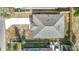 Aerial view of a home showcasing the roof, driveway, and surrounding yard at 4503 Courtland St, Tampa, FL 33610