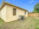 Backyard view with tan siding and window at 4503 Courtland St, Tampa, FL 33610