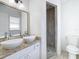 Bathroom featuring double sinks and walk-in shower at 4503 Courtland St, Tampa, FL 33610