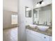 Bathroom with double sinks and a large mirror at 4503 Courtland St, Tampa, FL 33610